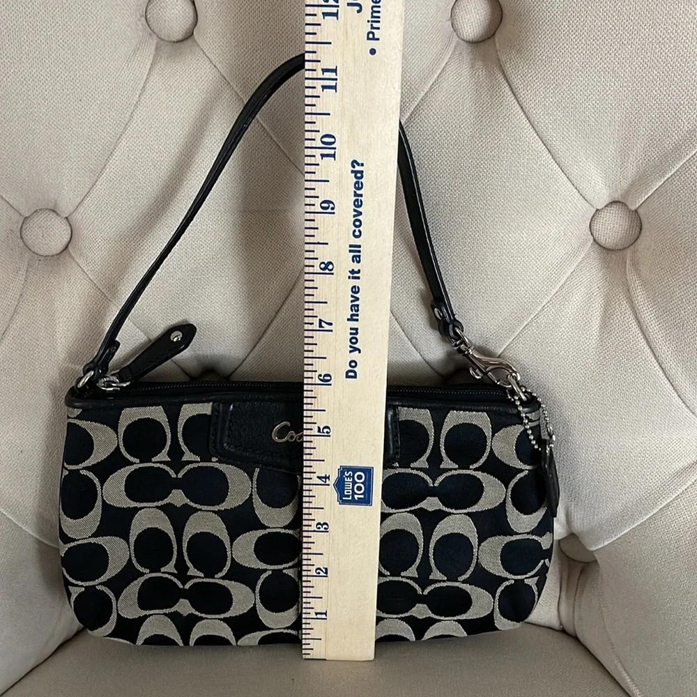 Coach black and tan jacquard logo and black leather clutch wristlet_11